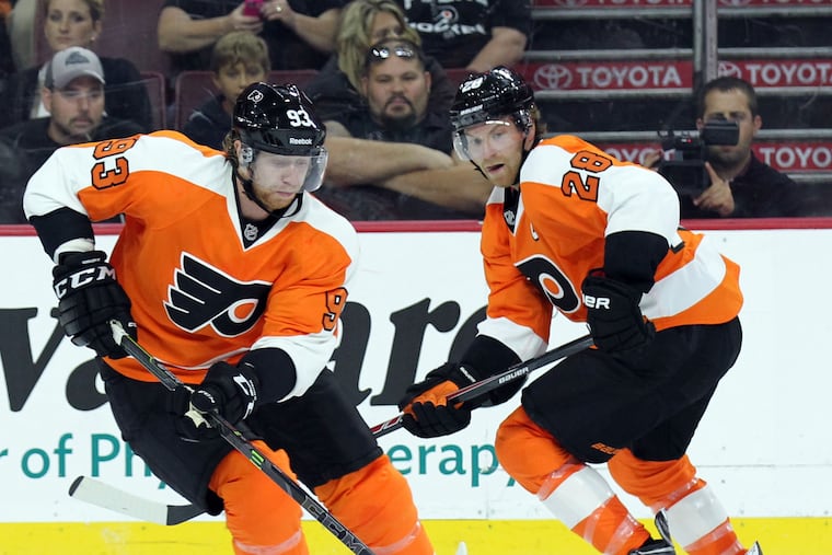 Either Jake Voracek (left) or Claude Giroux (right) had played in every Flyers game in the last 12 years, until they were both sidelined Thursday against the visiting New York Rangers.