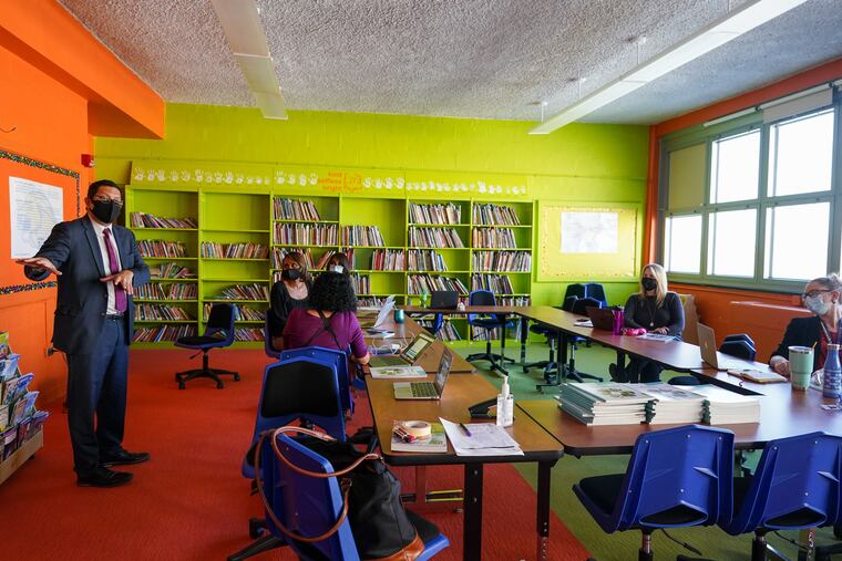 Pennsylvania Education Secretary Noe Ortega greets teachers and administrators at Robert E. Lamberton Elementary School in Woodbine, Pa., on November 16, 2021.