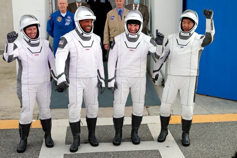 NASA astronauts, from left, Shannon Walker, Victor Glover, and Michael Hopkins and Japan Aerospace Exploration Agency astronaut Soichi Noguchi leave the Operations and Checkout Building on their way to launch pad 39A for the SpaceX Crew-1 mission to the International Space Station at the Kennedy Space Center in Cape Canaveral, Fla., Sunday, Nov. 15, 2020.