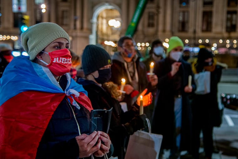 Fairhill community organizer and Philly Boricua volunteer Charito Morales (left) joins members of other community organizations in January to demand then-President-elect Joe Biden cancel student debt.