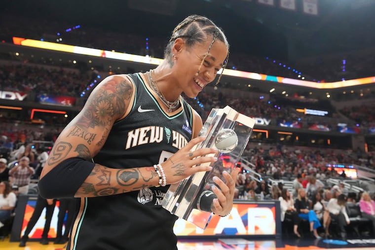 New York Liberty guard Natasha Cloud holds the trophy after winning the skills challenge at WNBA All-Star weekend in Indianapolis.