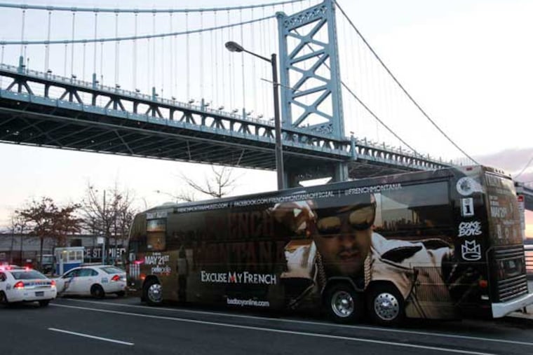 Philadelphia police near the tour bus of rapper French Montana on Delaware Avenue, site of shooting. (Alejandro A. Alvarez / Staff Photographer)
