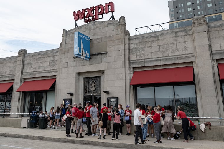 Workers gathered outside before a Town Hall meeting at World Cafe Live on Thursday, July, 2025. A 'Cease Operations - Stop Work Order' notice from the City of Philadelphia's Department of Revenue was posted on the University City venue's door on Wednesday.
