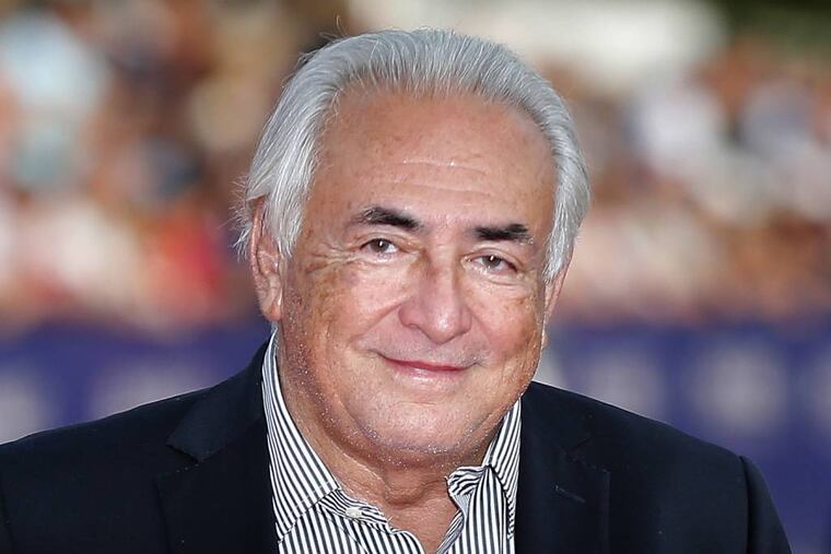 FILE - This Saturday, Sept. 13, 2014, file photo shows former IMF Secretary General Dominique Strauss-Kahn arriving for the award ceremony at the 40th American Film Festival in Deauville, Normandy, western France. (AP Photo/Jacques Brinon, File)