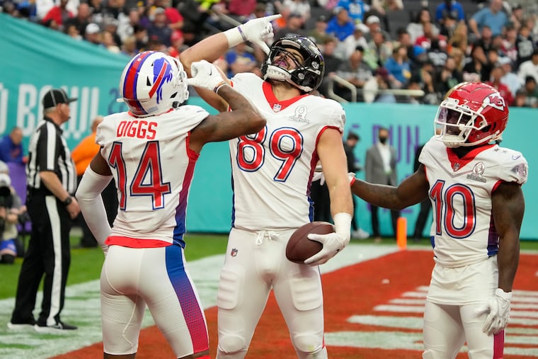 AFC tackle Mark Andrews (89), of the Baltimore Ravens, reacts with wide receiver Stefon Diggs (14), of the Buffalo Bills, and wide receiver Tyreek Hill (10), of the Kansas City Chiefs, after Andrews scored a touchdown in the first half of the Pro Bowl NFL football game against the NFC, Sunday, Feb. 6, 2022, in Las Vegas. (AP Photo/Rick Scuteri)