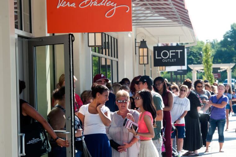 Customers line up at the Vera Bradley shop at the Gloucester Premium Outlets in Gloucester Township. (AVI STEINHARDT / For The Inquirer)