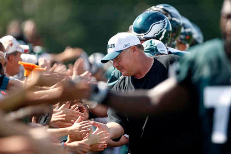 Andy Reid and Eagles players shake hands with fans on last day of training camp.