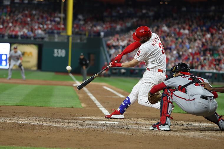 Bryce Harper of the Phillies hits a 3-run home run off of Stephen Strasburg of the Nationals in the 3rd inning at Citizens Bank Park on April 9, 2019.