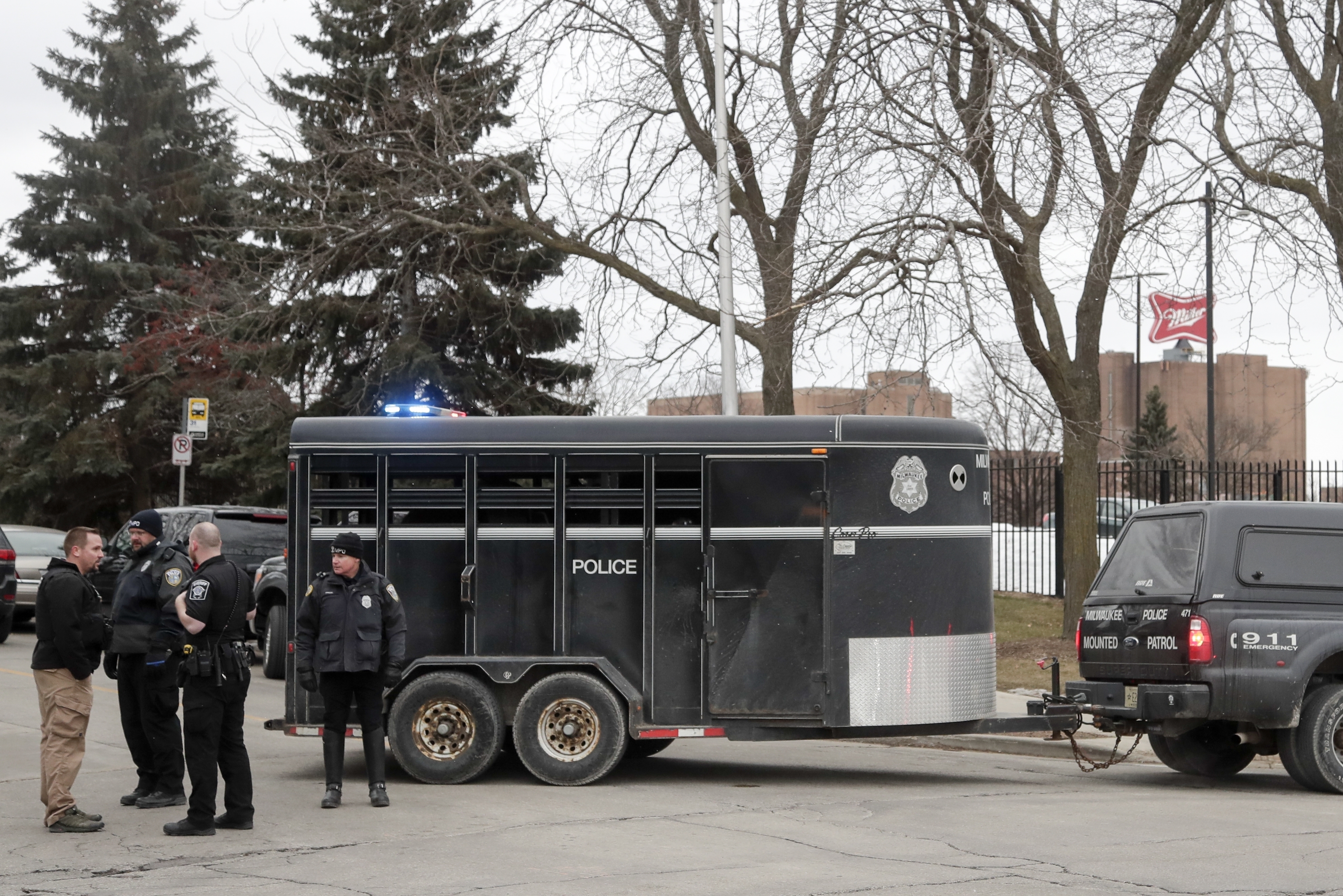 Police work outside the Molson Coors Brewing Co. campus in Milwaukee on Wednesday, Feb. 26, 2020, after reports of a possible shooting.