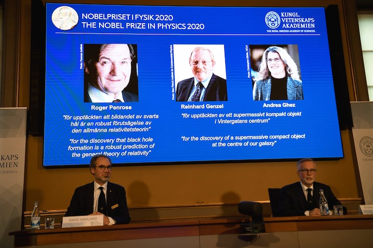 David Haviland, member of the Nobel Committee for Physics, left, and Goran K. Hansson, Secretary General of the Academy of Sciences, announce the winners of the 2020 Nobel Prize in Physics during a news conference at the Royal Swedish Academy of Sciences, in Stockholm, Sweden, on Tuesday.