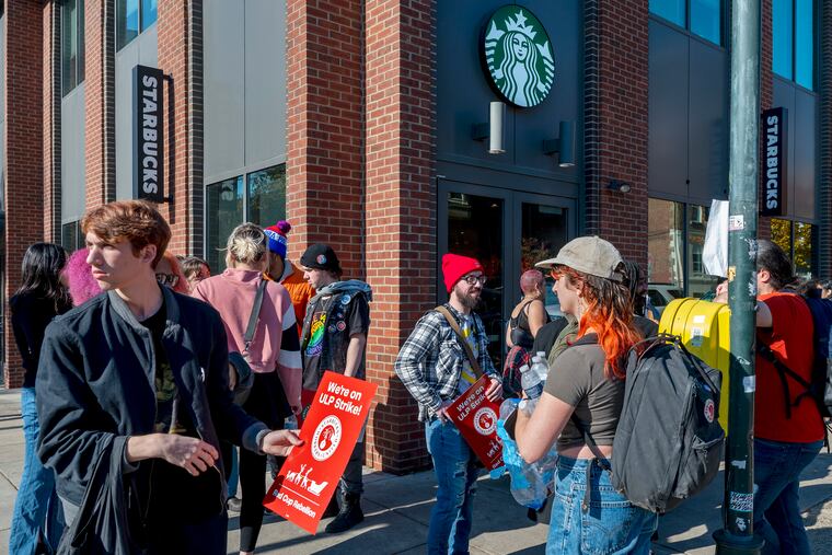 Baristas outside the Starbucks at 39th and Walnut Streets on Thursday, Nov. 16, 2023. Workers from at least six Philadelphia Starbucks locations went on strike during the company's Red Cup Day. Meant to launch the holiday season for Starbucks, this day is known for being extremely busy without any additional staffing or support for workers, the worker union says.