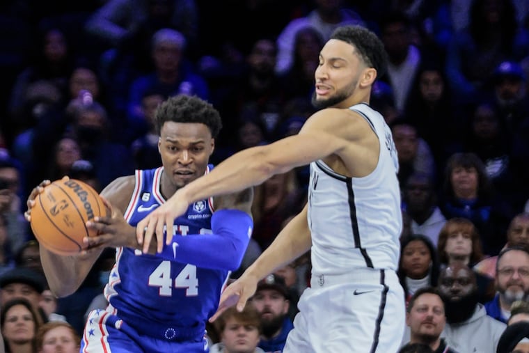 Sixers Paul Reed keeps the ball from Nets Ben Simmons during the 2nd quarter at the Wells Fargo Center in Philadelphia, Tuesday, November 22, 2022.