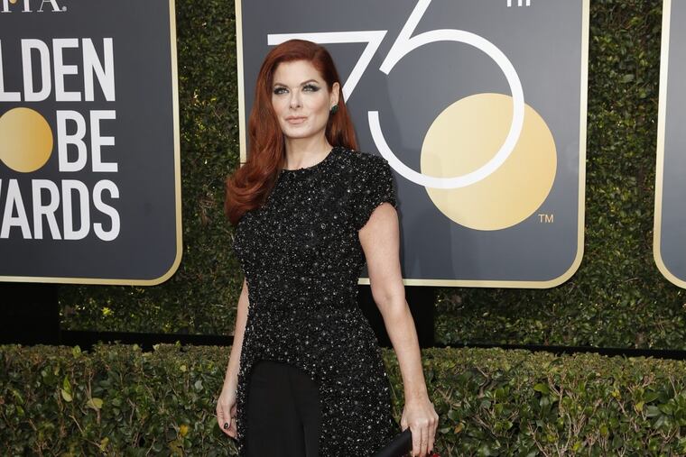 Debra Messing arrives at the 75th Annual Golden Globes at the Beverly Hilton Hotel in Beverly Hills, Calif., on Sunday, Jan. 7, 2018.