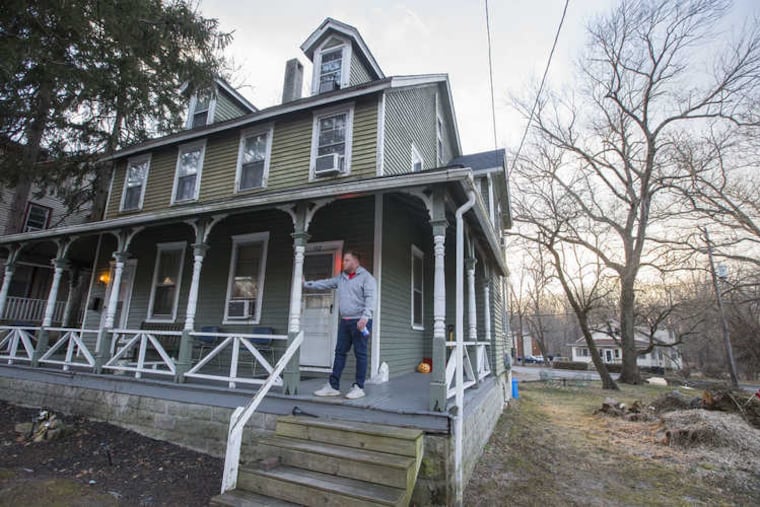 Tim Meise on the porch of one of the two sober-living houses he opened in Medford, N.J., in 2018. Members of a nearby church recently brought dinner to the seven men who live there.