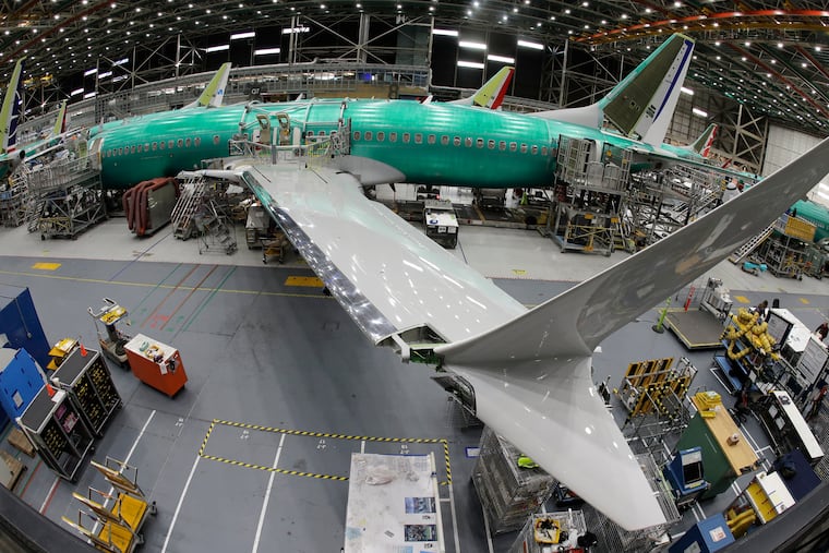 In this photo taken with a fish-eye lens, a Boeing 737 MAX 8 airplane sits on the assembly line during a brief media tour in Boeing's 737 assembly facility, Wednesday, March 27, 2019, in Renton, Wash. The Federal Aviation Administration plans to revamp oversight of airplane development after the two deadly crashes of Boeing's new 737 Max 8 airplane, according to testimony prepared for a Capitol Hill hearing on Wednesday.