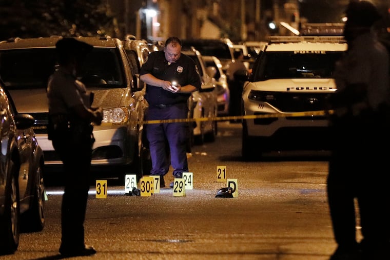 Philadelphia police process evidence at South Cleveland Street and Moore Street in Philadelphia after four people were shot just after 8 pm on Sept. 2, 2020. Two teenagers died.
