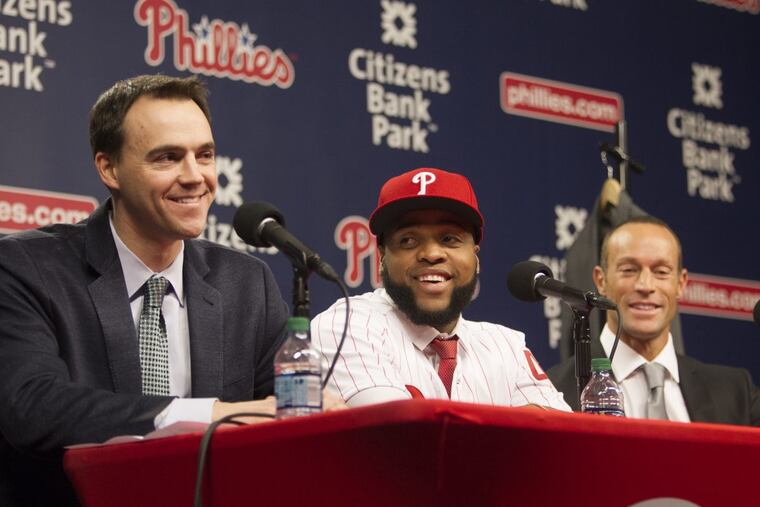 Philadelphia Phillies general manager Matt Klentak (left) with newly-signed first baseman Carlos Santana (center) and manager Gabe Kapler (right).