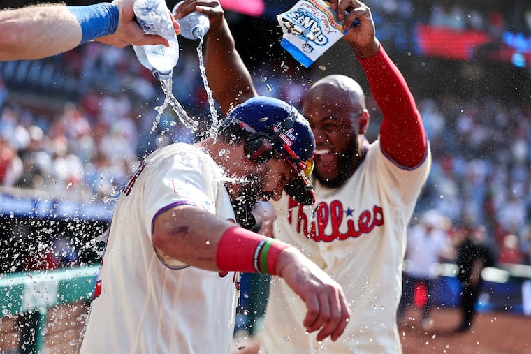 Phillies first baseman Kyle Schwarber celebrates his walk-off home run with teammates.