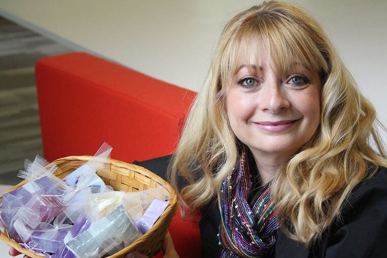 Diane Dilemani, a former makeup artist, is selling all-natural soaps that she says keep skin soft. (JESSICA GRIFFIN / STAFF PHOTOGRAPHER)