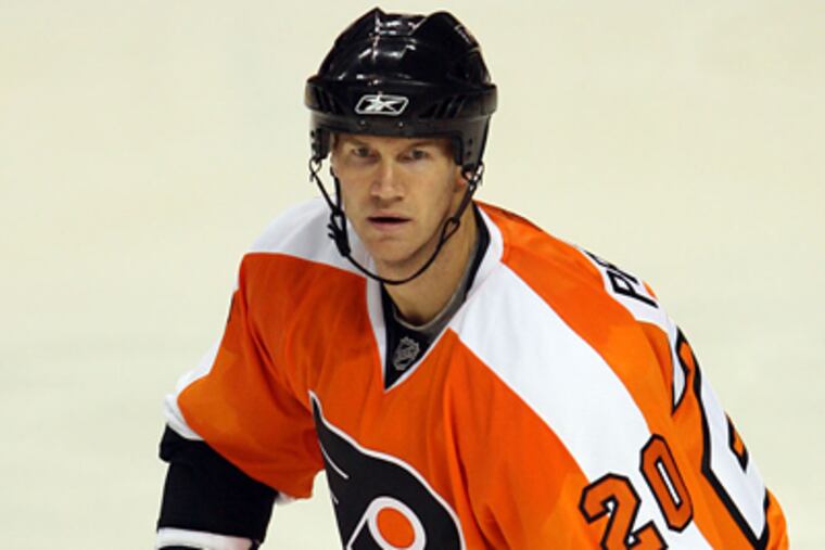 Chris Pronger waits for the puck during a preseason game against the Detroit Red Wings. (Yong Kim / Staff Photographer)