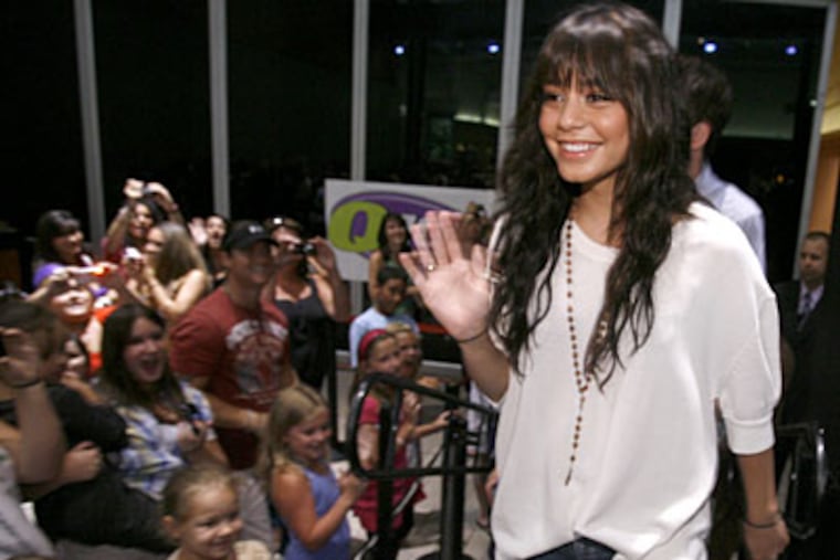 Vanessa Hudgens waves to fans who’d waited for her at Franklin Mills. (CHARLES FOX / Staff Photographer)