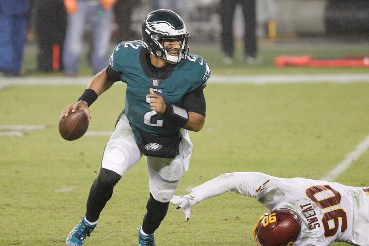 Eagles quarterback Jalen Hurts, shown escaping a pass rusher last season, hopes to improve his consistency this year.