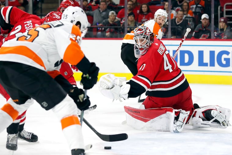 Carolina Hurricanes goaltender James Reimer (47) defends the goal against James van Riemsdyk (25) during the first period on Tuesday.