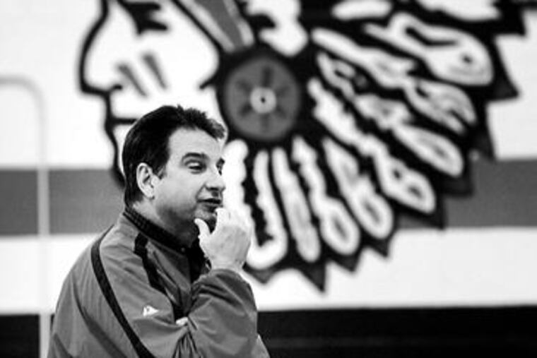 Coatesville coach Rick Nelms watches as his team runs sprints during practice.In his first year with the program, he led the Red Raiders to a 19-7 mark.