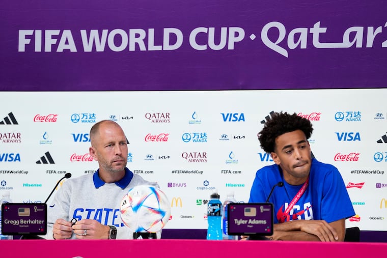 U.S. manager Gregg Berhalter and captain Tyler Adams listen to questions at a news conference Monday.