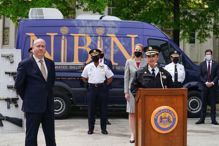 Police Commissioner Danielle Outlaw, right, at the podium, answers questions from the media, Mike Garvey, Philadelphia Police Department from the Office of Forensic Science, front left, shown here during a press conference to announce and provide demonstrations of new forensic support services that are aimed to bolster PPD’s Forensic Investigative capacities, at the Philadelphia Police Department Office of Forensic Science, May 7, 2021.