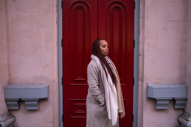 Lynee Boney, 30, of Germantown Philadelphia, poses for a portrait outside in Center City on Tuesday, Nov. 12, 2019. Boney has a lawsuit open against her former employer, myDoc Urgent Care, who she says cut her hours from 40 to 5 per week after she got pregnant. "I was hurt," Boney said. "I was hurt and it just made me think about my future and that I have to plan better. It caused a lot of fall back for me and other people because they were taking care of me and my child."