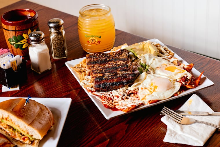 The chilaquiles divorciados dish, paired with a passionfruit drink, rests on a table at Chilaqueria Los Girasoles in Pleasantville, N.J. on Friday, June 19, 2026.