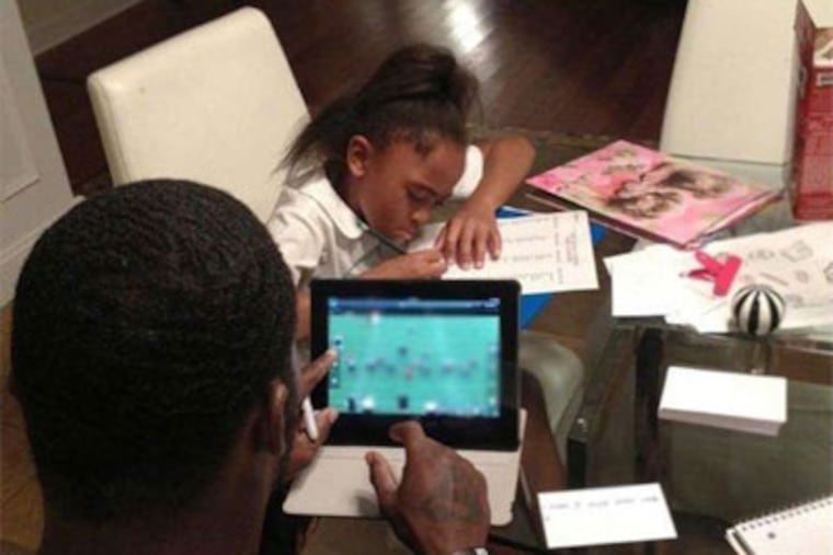 Photo that Michael Vick tweeted shows telltale open box of Milk-Bones on his kitchen table. Vick now is allowed to own a dog.