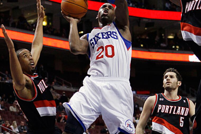 Jodie Meeks goes up for a shot as Portland Trail Blazers' Andre Miller, left, defends in the second half. (AP Photo/Matt Slocum)