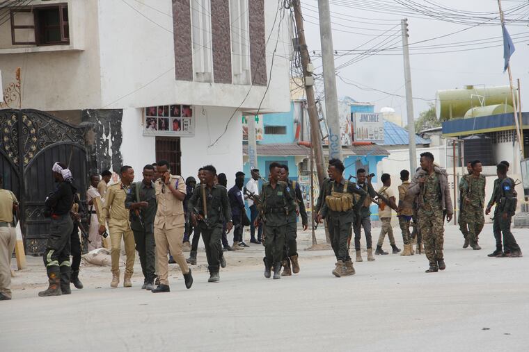 Soldiers patrol outside the Hayat Hotel in Mogadishu, Somalia, on Saturday.
