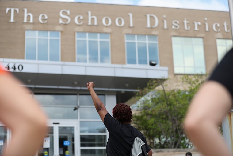 Teachers, principals, and others rally outside of the Philadelphia School District Headquarters Saturday, demanding that the school year begin virtually amid fears of coronavirus.