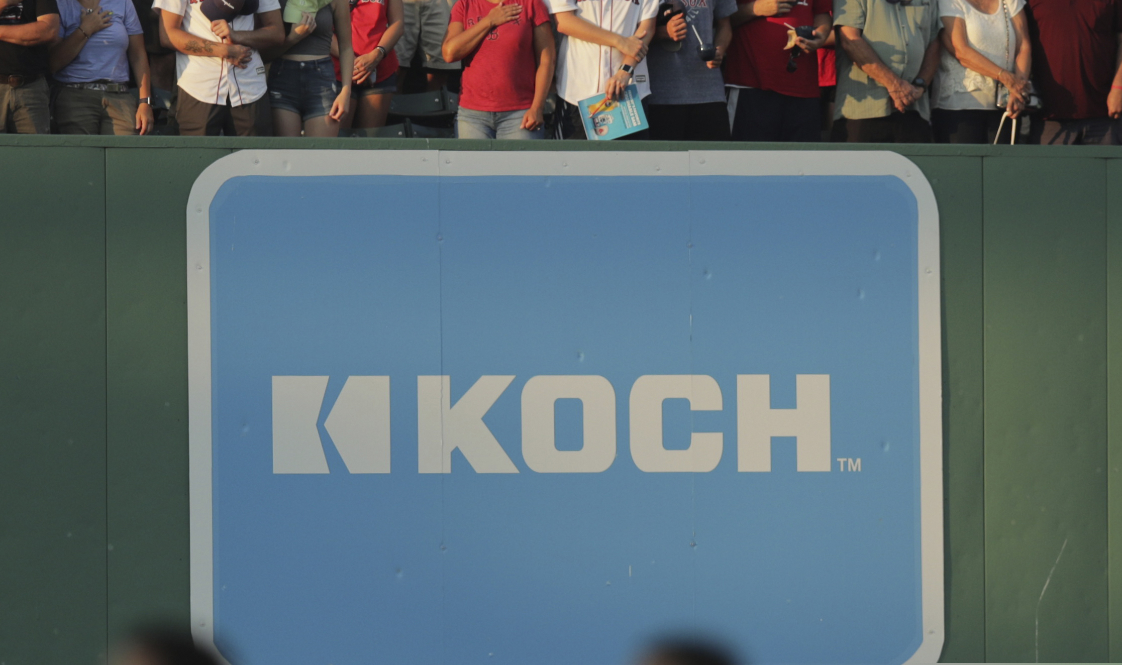 An advertising sign for Koch Industries is shown at Fenway Park in Boston in 2019.