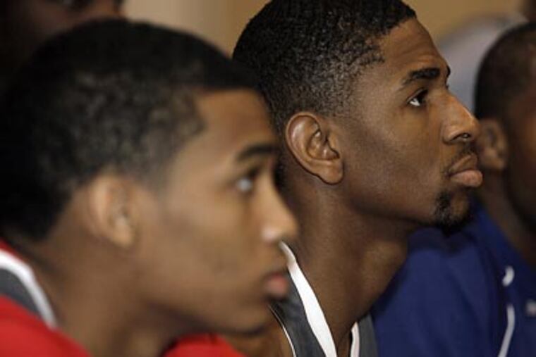 Olney grad Jesse Morgan (right) is displaying his skills at the Reebok All-American high school basketball camp in the hope of raising his stock for a scholarship. (Akira Suwa / Staff Photographer)