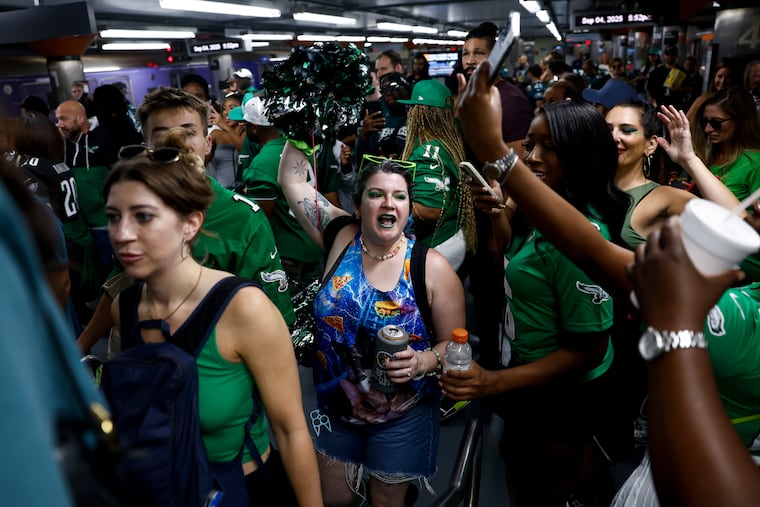 People cheer as they exit the train inside NRG station before the Philadelphia Eagles game on Thursday, Sept. 4, 2025 in Philadelphia.