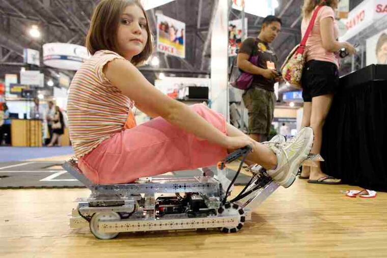 Kate Link of Hereford, Texas, takes a ride at the International Society for Technology in Education meeting at the Convention Center.