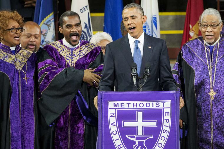 President Obama sings "Amazing Grace" during services in Charleston, S.C., on Friday honoring the life of the Rev. Clementa Pinckney. Pinckney was one of the nine people killed in the shooting at Emanuel A.M.E. Church in Charleston. (David Goldman/Associated Press)