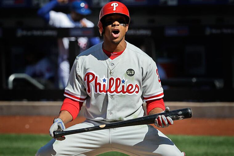 Philadelphia Phillies' Ben Revere reacts after striking out looking during the seventh inning of the baseball game against the New York Mets at Citi Field, Monday, April 13, 2015 in New York. (Seth Wenig/AP)
