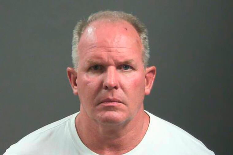 Doug Ramsey has been charged with felony battery after a fight outside a college football game in which he was accused of biting a man’s nose.