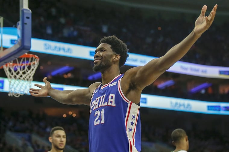 Sixers center Joel Embiid celebrates after getting fouled and making a basket about a minute after he baited Utah guard Donovan Mitchell into a technical foul on Monday night. YONG KIM / Staff Photographer.