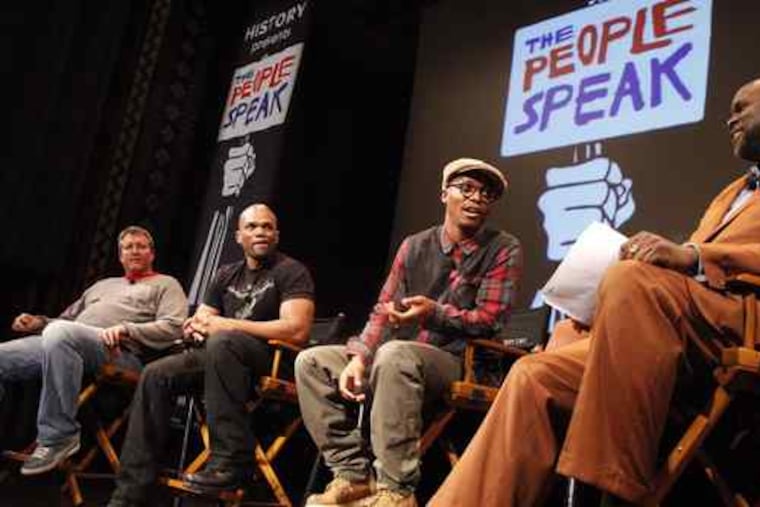 On stage for a Penn Q & A session on "The People Speak" were (from left) Chris Moore, Darryl McDaniels, Lupe Fiasco and professor Tukufu Zuberi. Segments of the film were shown.