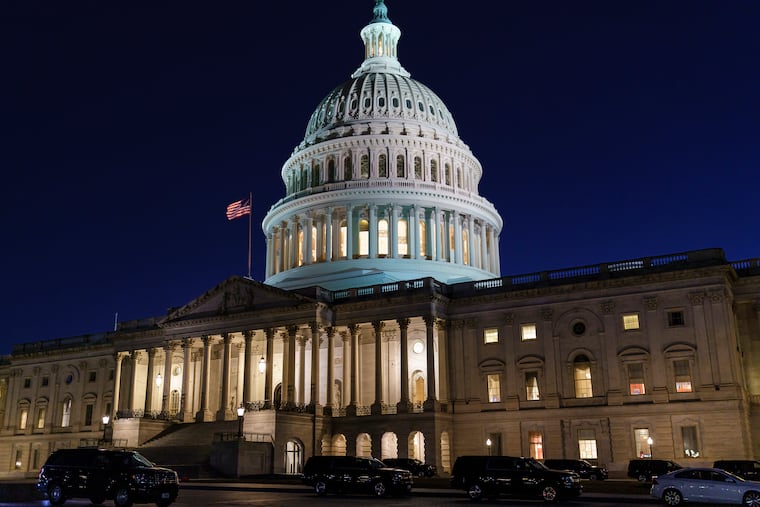The Capitol is seen at dusk as work in the Senate is stalled on the Democrats' $1.9 trillion COVID-19 relief bill, in Washington, Friday, March 5, 2021. Senators plan to continue to vote on amendments through the night.