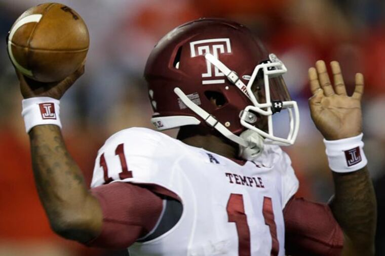 Temple quarterback P.J. Walker passes against Cincinnati in the first half of an NCAA college football game, Friday, Oct. 11, 2013, in Cincinnati. (Al Behrman/AP)