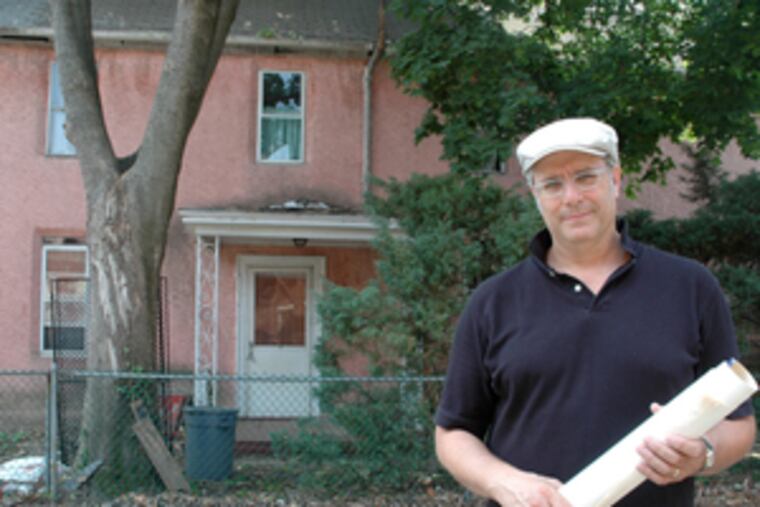Todd Kimmel at the house; the 1690 section is to his left.
