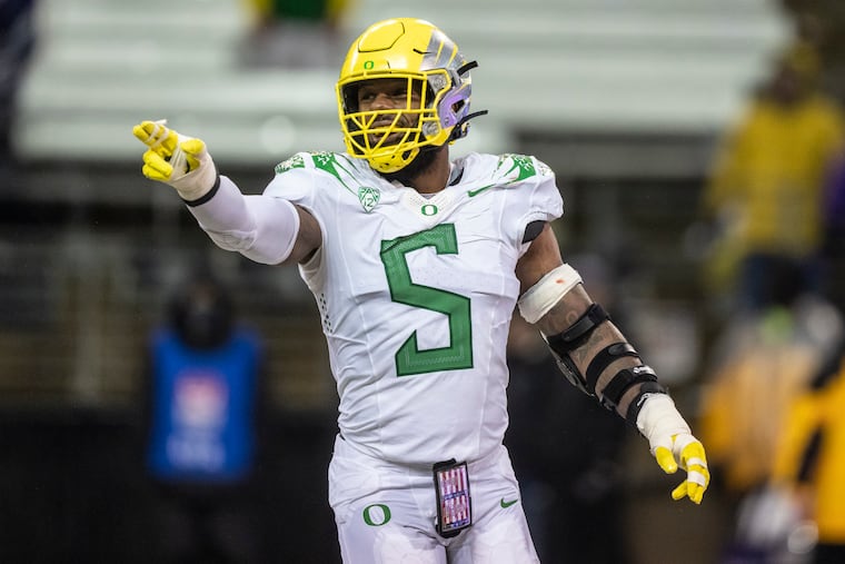 Oregon defensive end Kayvon Thibodeaux celebrates after Oregon scored a safety during the second half of an NCAA college football game against the Washington, Saturday, Nov. 6, 2021, in Seattle. Oregon won 26-16. (AP Photo/Stephen Brashear)