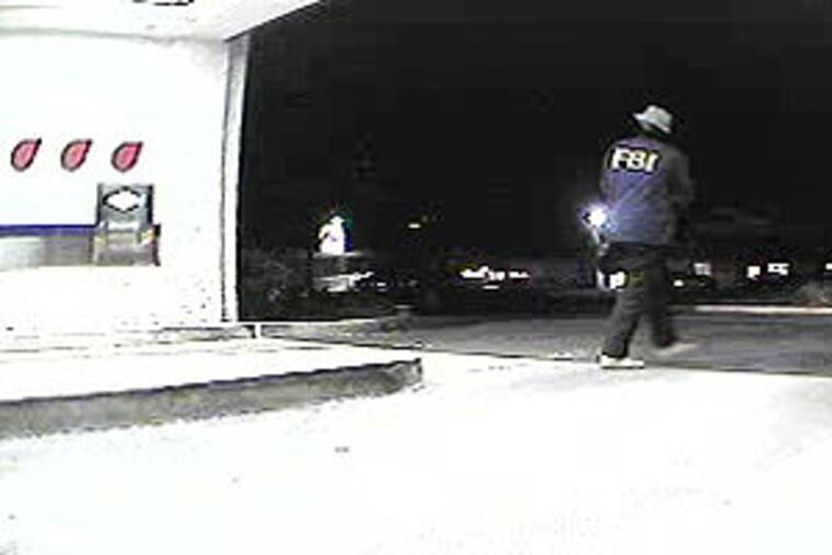 The robber received his demand of $1,000 and then walked off in the direction of the Park Place Condominiums.